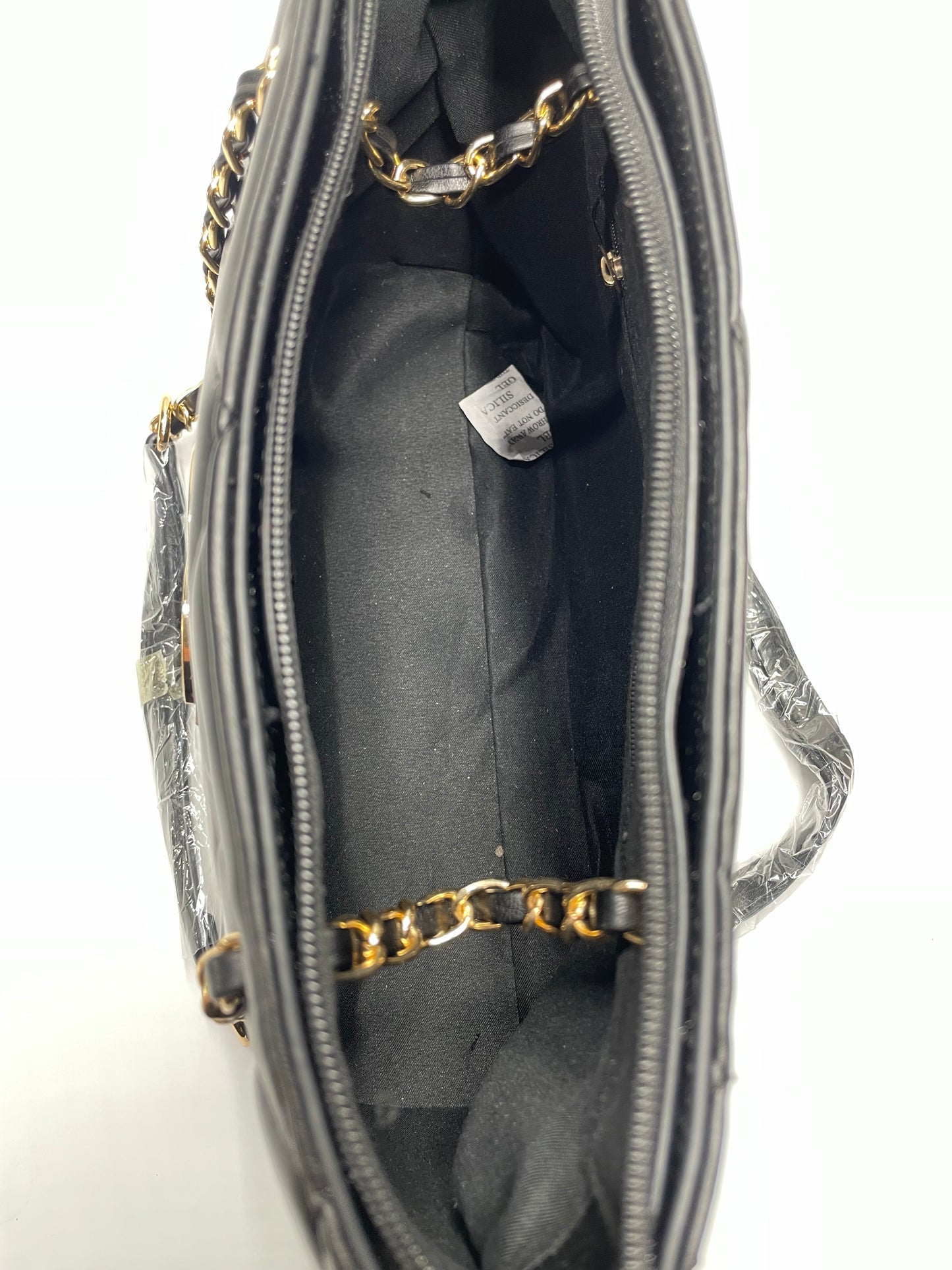 Womens black channel quilted handbags