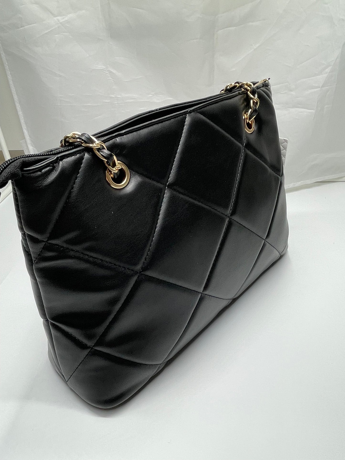 Womens black channel quilted handbags