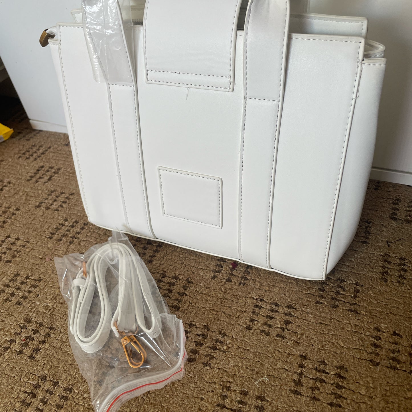 White tote bag with golden hardware