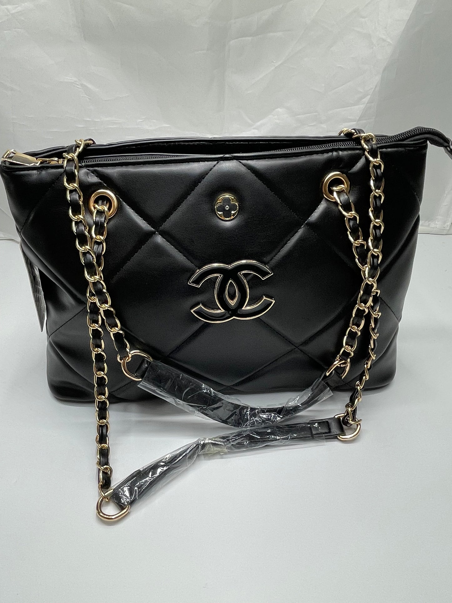 Womens black channel quilted handbags
