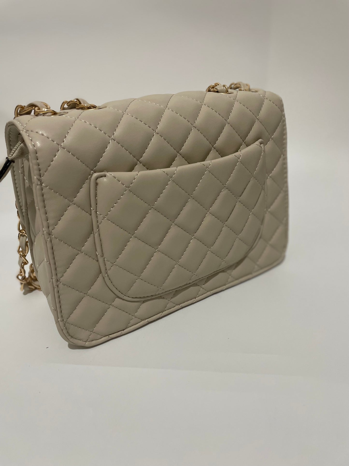 Cream channel quilted chain shoulder crozzbody bag