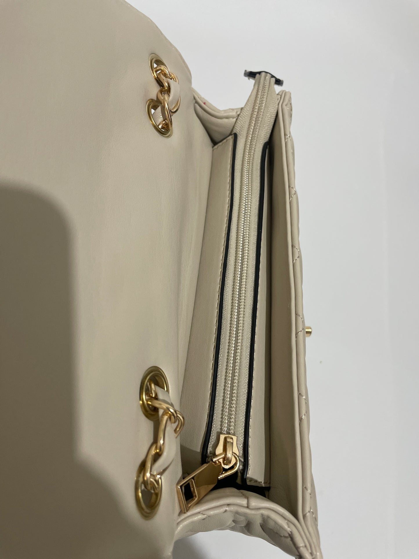 Cream channel quilted chain shoulder crozzbody bag