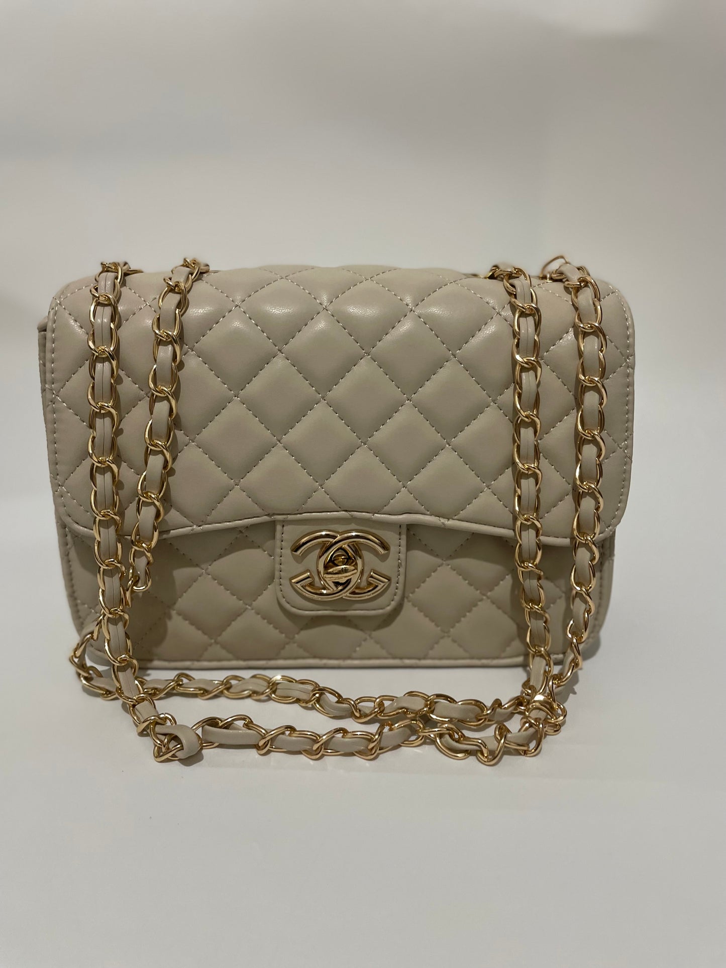Cream channel quilted chain shoulder crozzbody bag