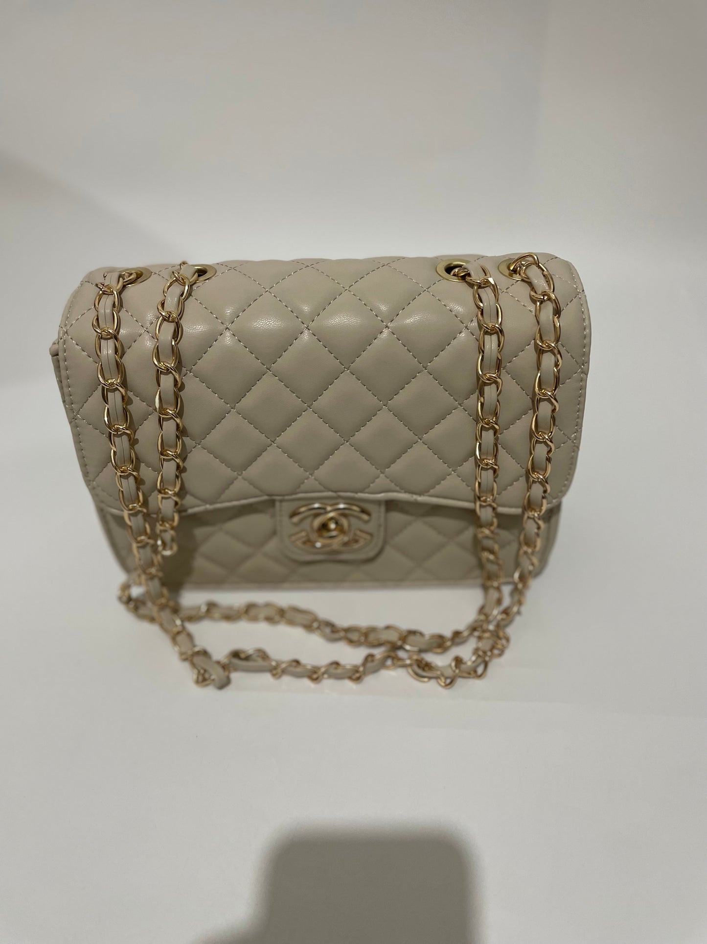 Cream channel quilted chain shoulder crozzbody bag