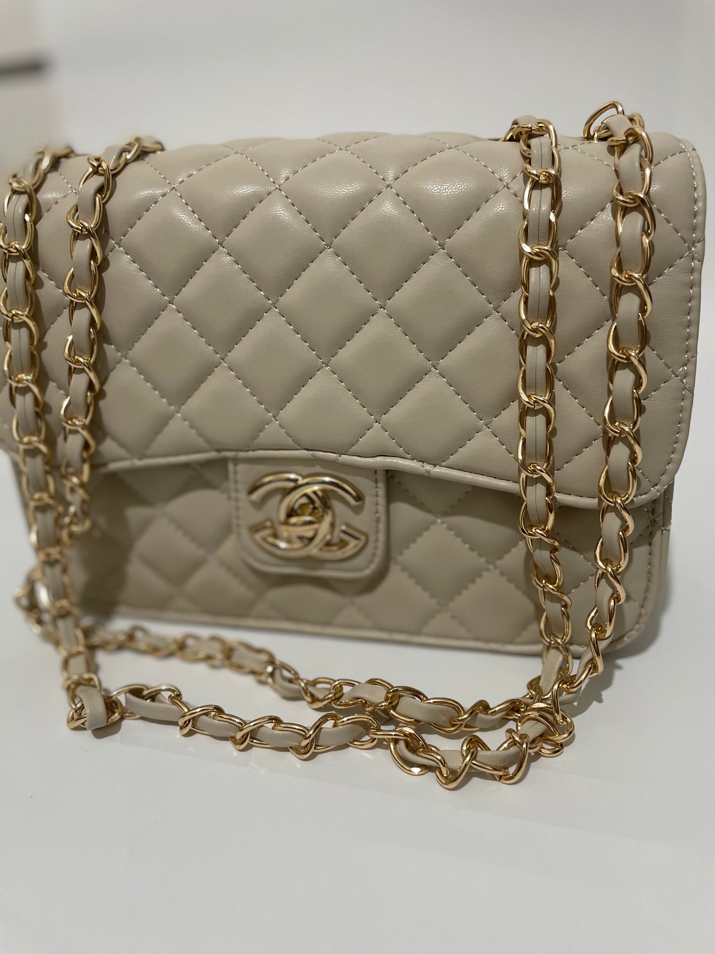 Cream channel quilted chain shoulder crozzbody bag
