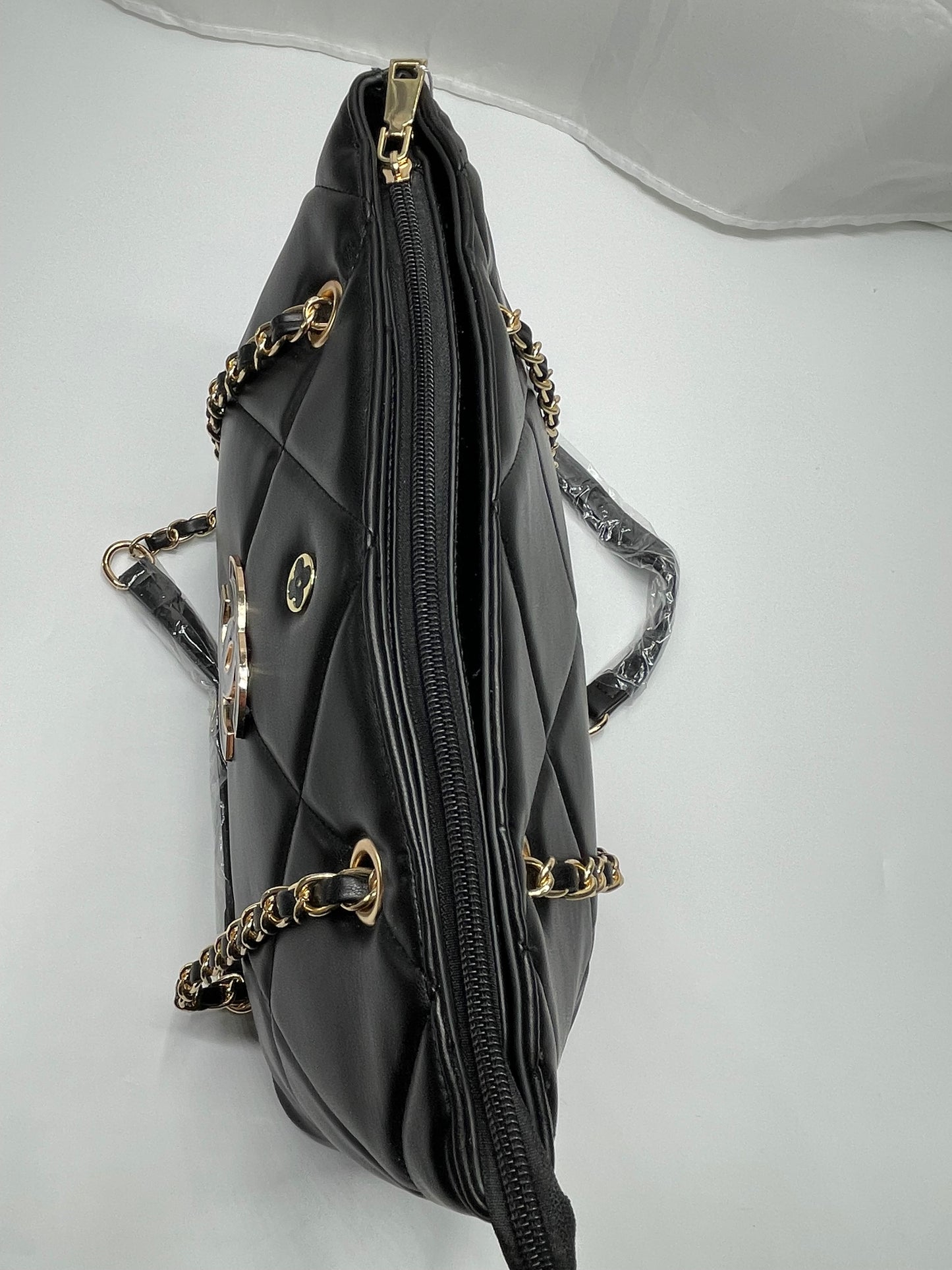 Womens black channel quilted handbags